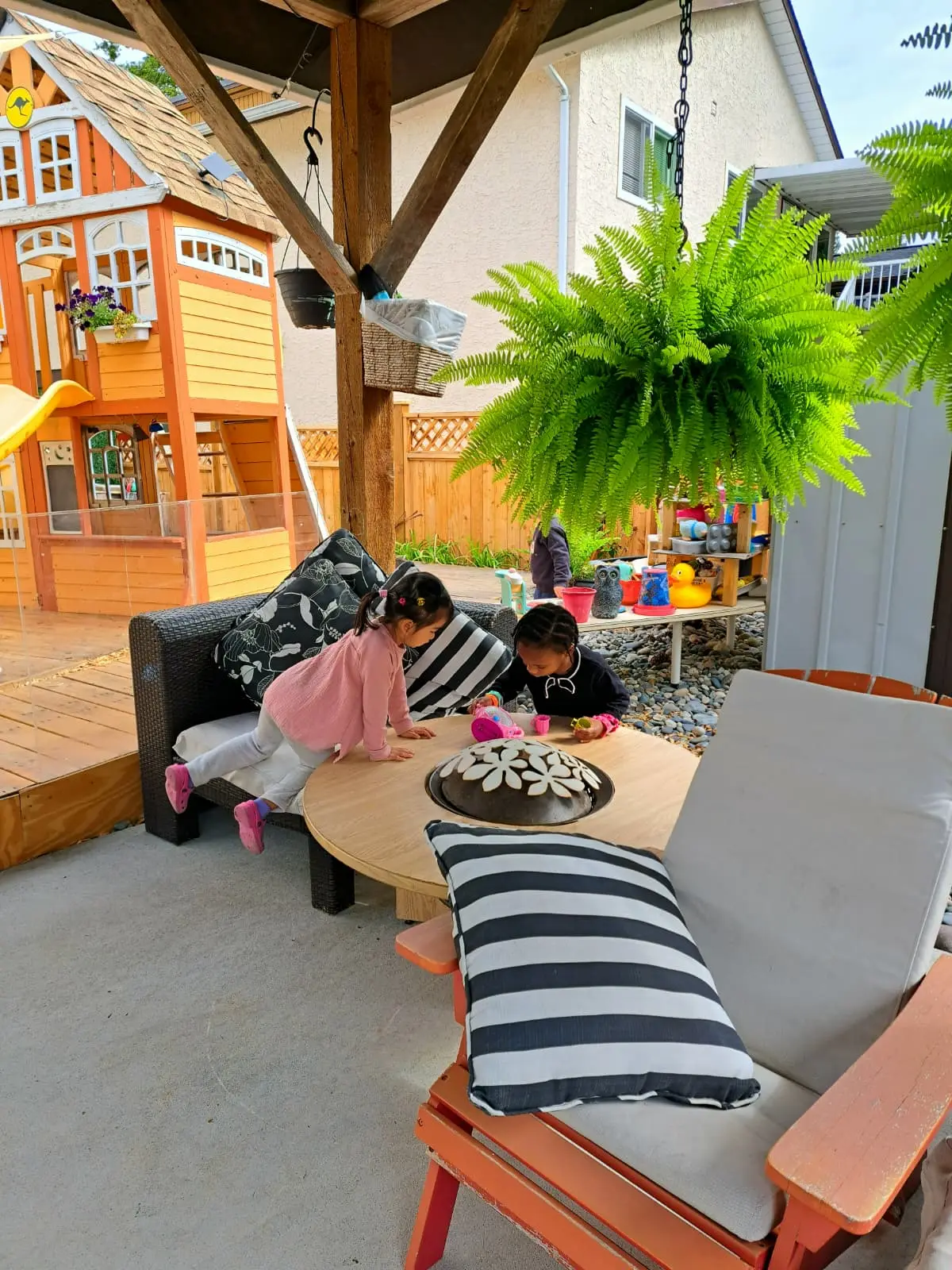 Children playing together in the outdoor daycare patio