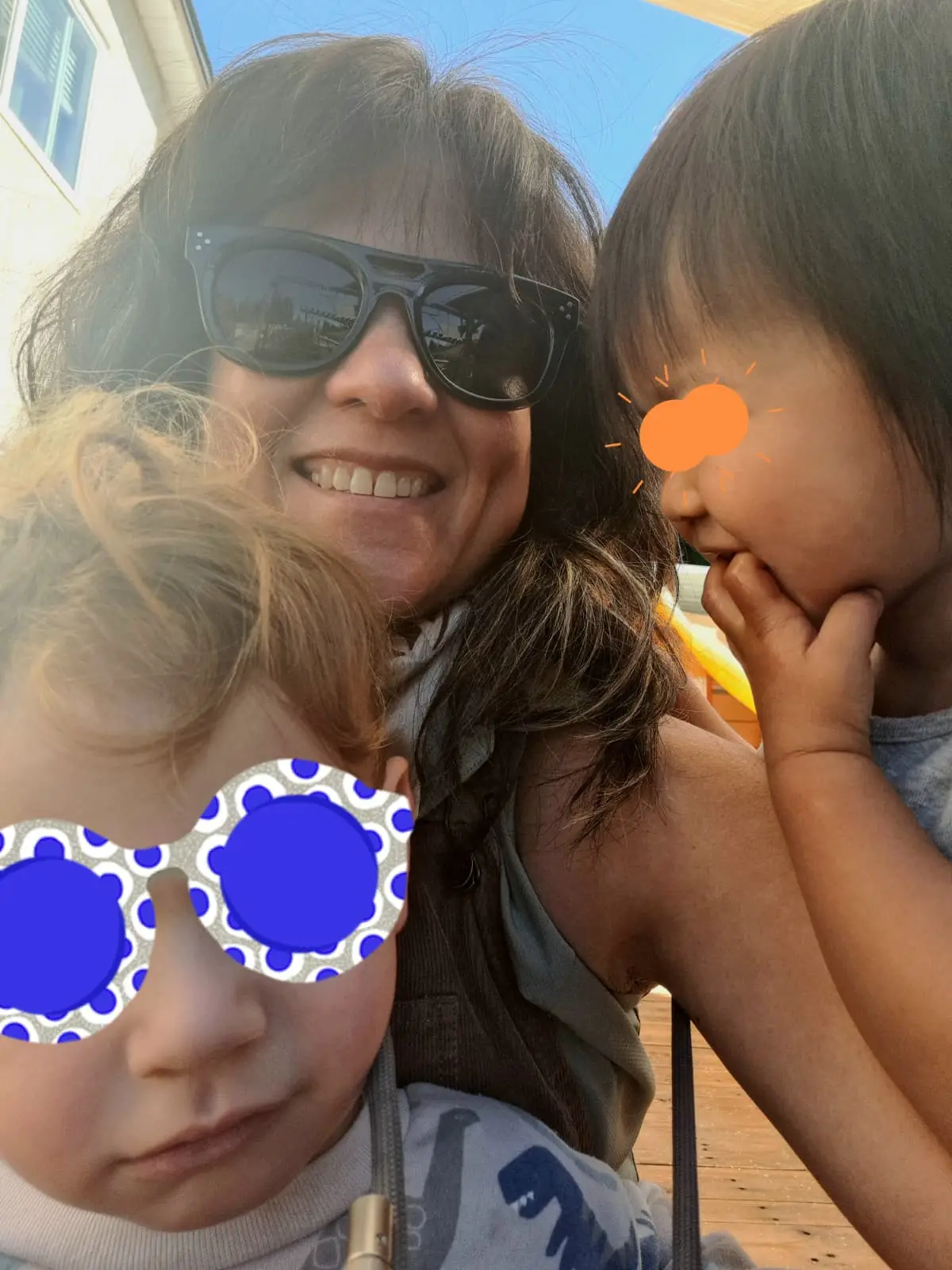 Daycare educator sharing a moment with children outdoors